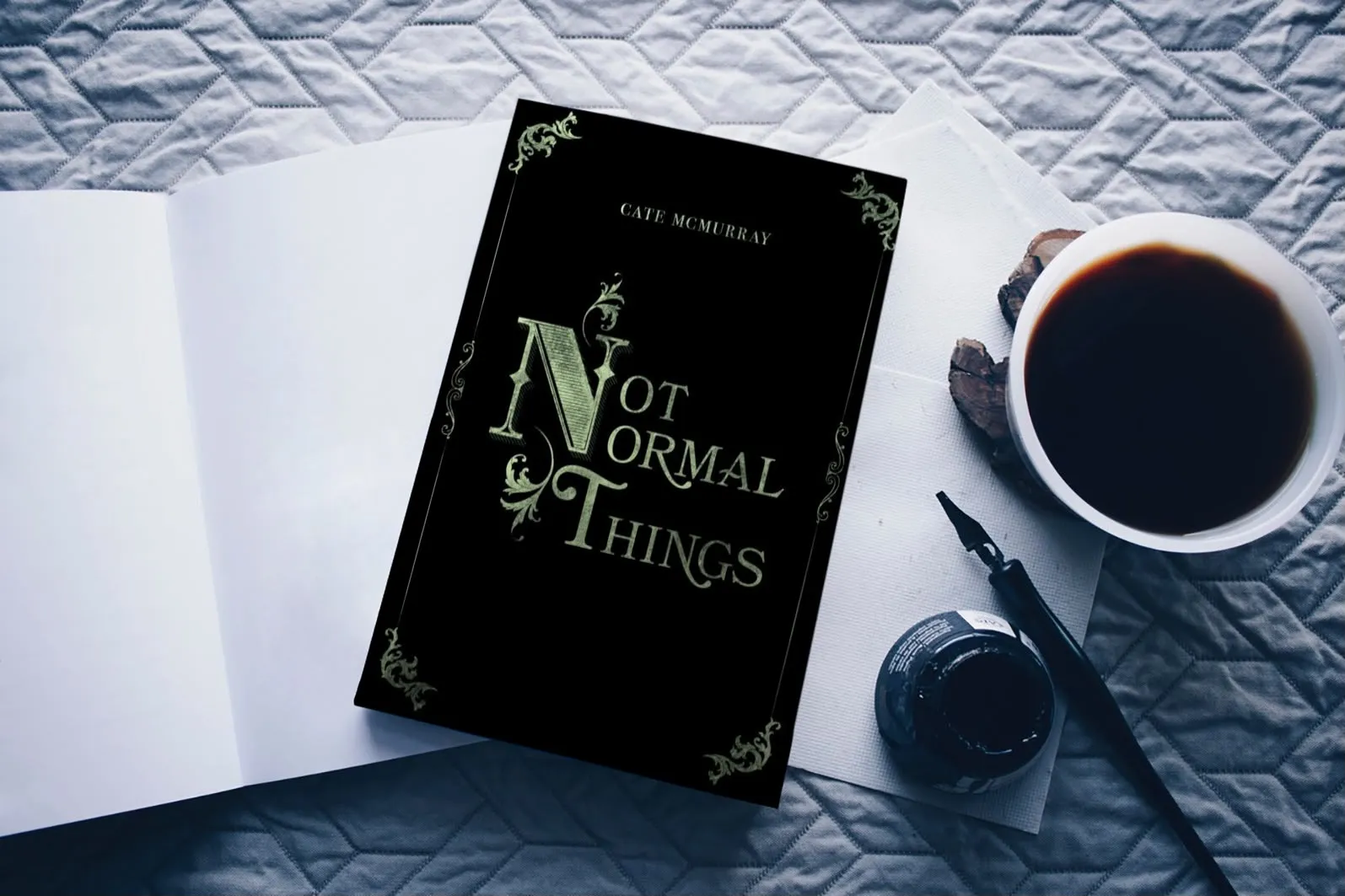 Not Normal Things book by Cate McMurray with a cup of coffee